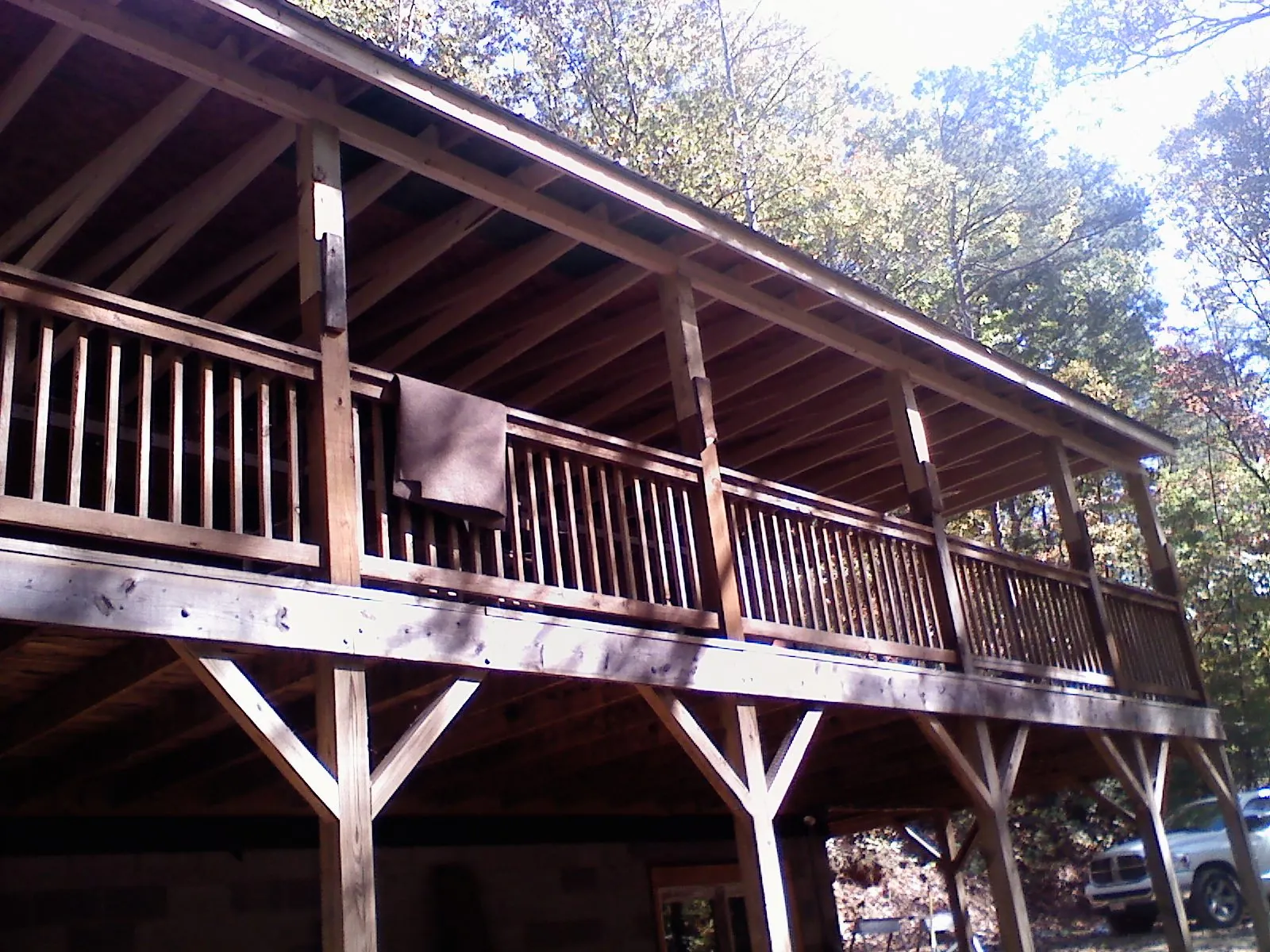 Timber framing under a new elevated porch and deck — Roof Leak Repair in Cement by Roofing Brothers